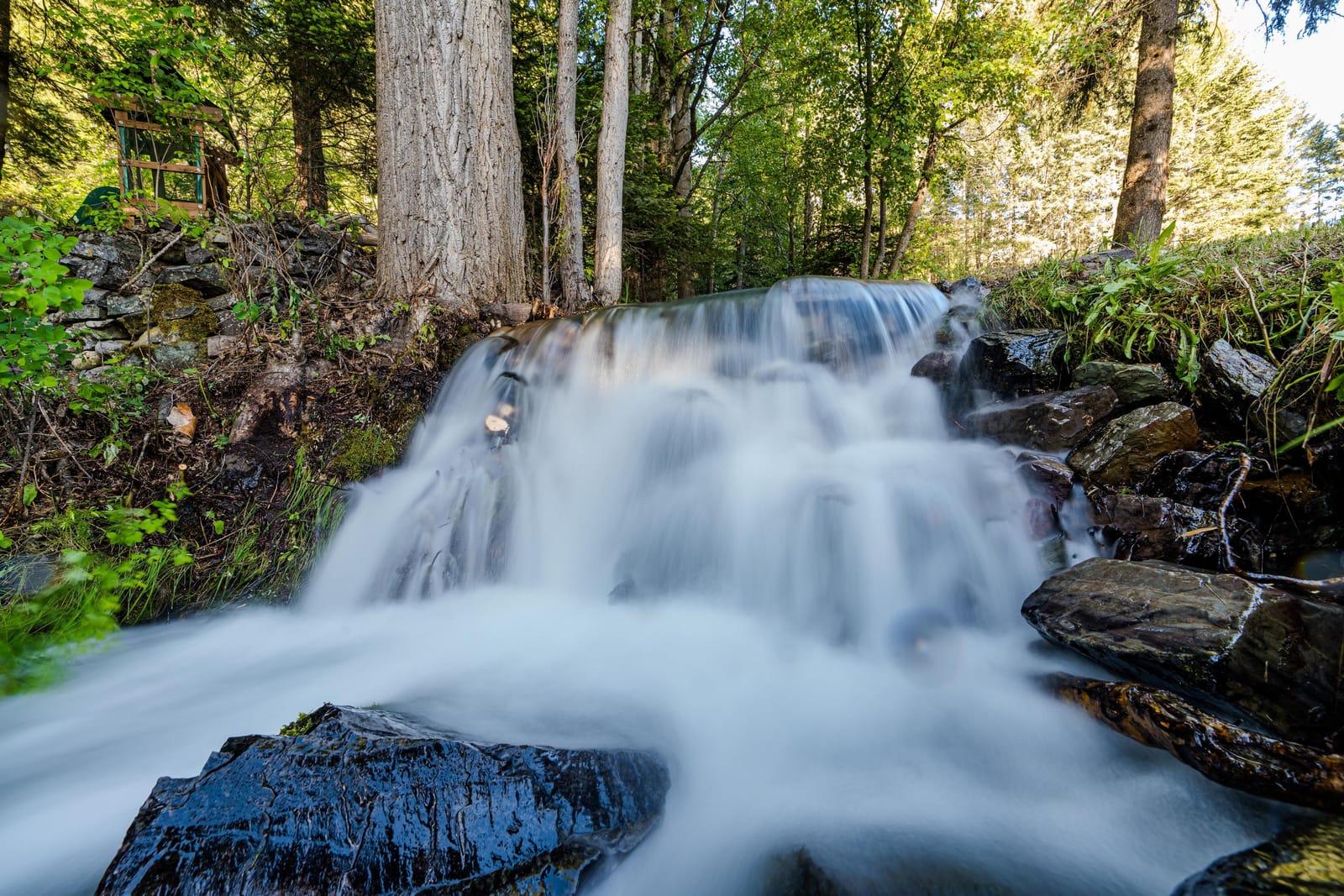 The cascading waterfall just outside the cabin door